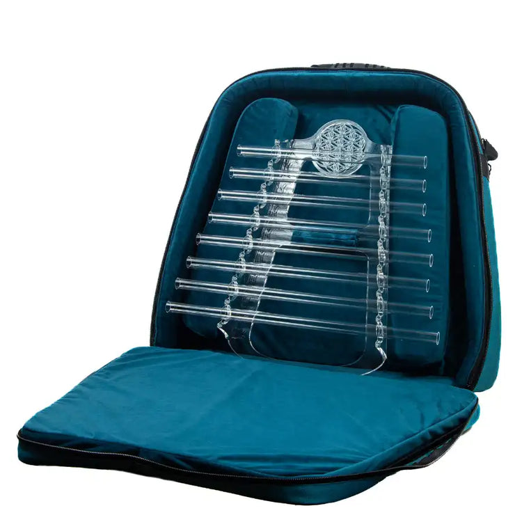 Crystal Harp in open teal protective backpack, diagonal product view showing quartz tubes