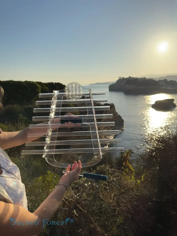 
                    
                      Mystic E sacred Forest Crystal Harp in natural landscape
                    
                  