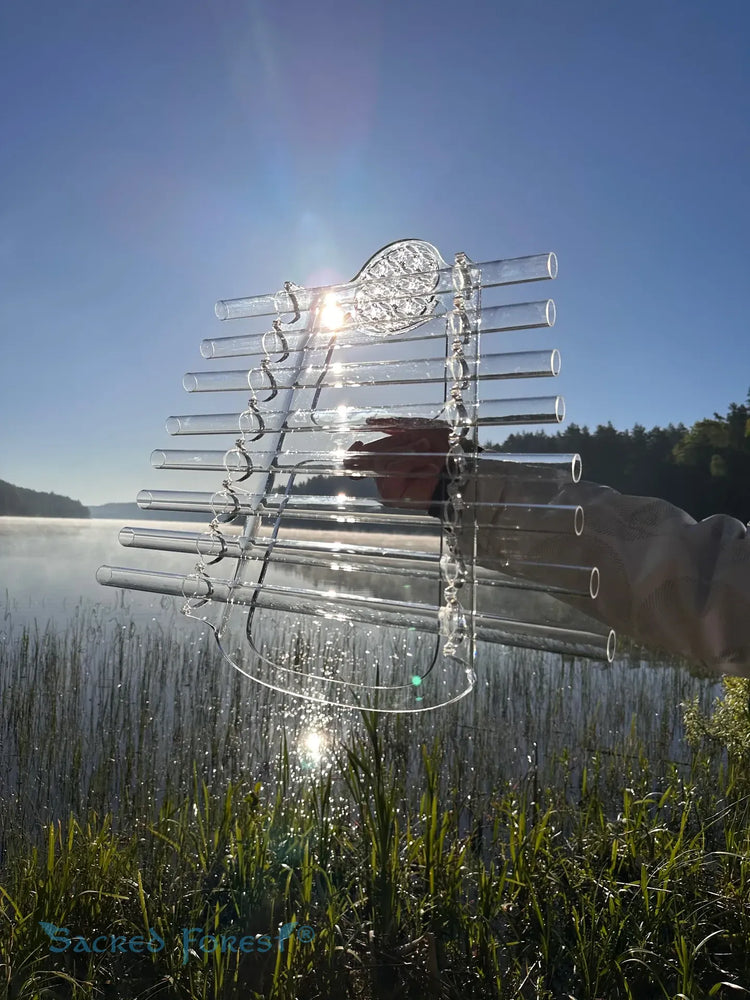 
                    
                      Sun D Sacred Forest Crystal Harp final nature photography over the lake
                    
                  